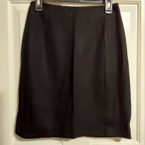 Two gorgeous, flattering, body skimming wool skirts.  1 black, 1 red.